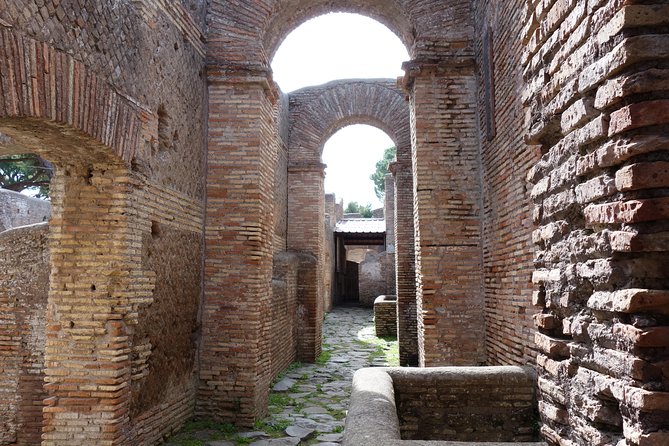 Ancient Ostia Antica Semi-Private Day Trip from Rome by Train with Guide - Baths of Neptune and the Forum of the Corporations