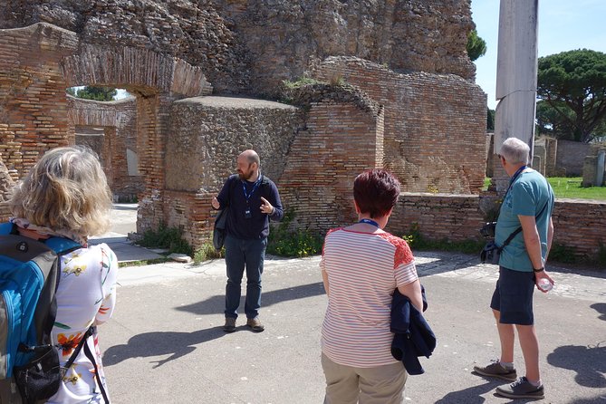 Ancient Ostia Antica Semi-Private Day Trip from Rome by Train with Guide - Sitting in the ancient amphitheater