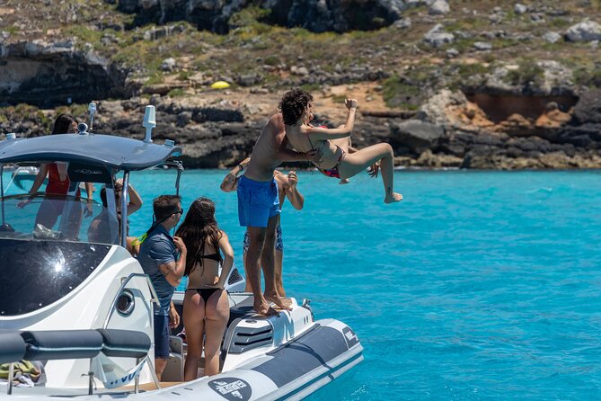 Boat Tour Egadi Day discover Favignana and Levanzo from Trapani - Cala Rossa delivers the classic Favignana view