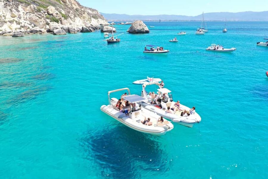Cagliari: Boat Tour, 4 Stops, Swim, Snorkeling, & 1 Spritz - The skippers shape the mood
