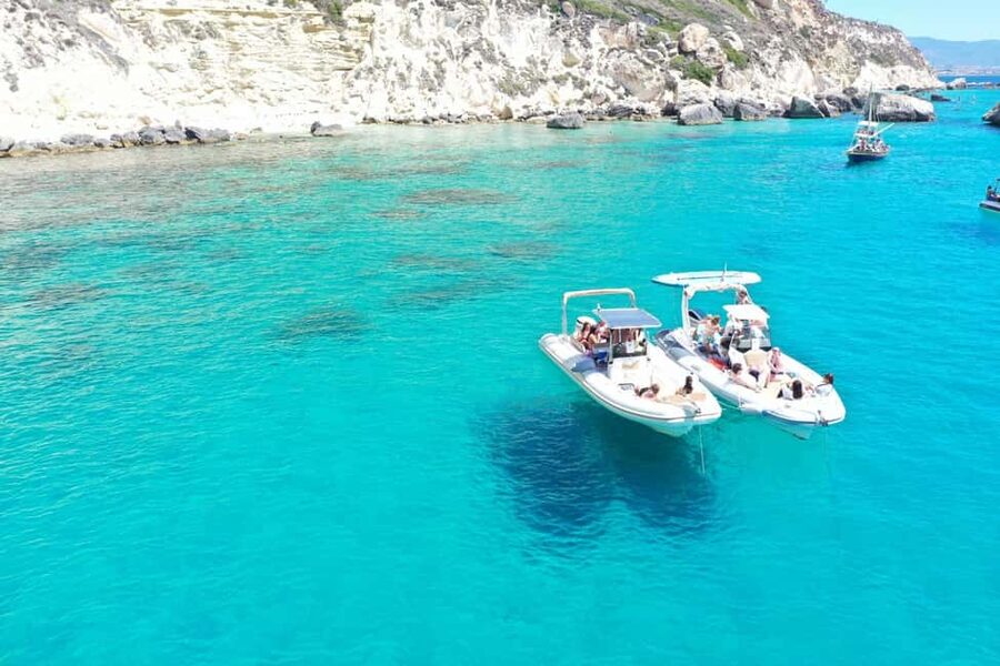 Cagliari: Boat Tour, 4 Stops, Swim, Snorkeling, & 1 Spritz - Boarding an 8-meter RIB near Bacan Cagliari