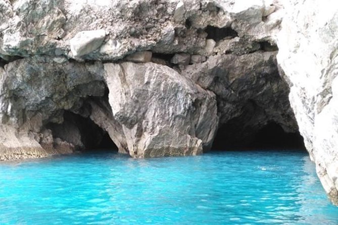 Capri Boat Tour from Sorrento: Swim, Grottos & Light Lunch - Swimming, snacks, and the included Caprese lunch