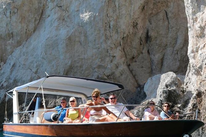 Capri Boat Tour from Sorrento: Swim, Grottos & Light Lunch - Capri’s White Grotto, Green Grotto, and cliffside sights
