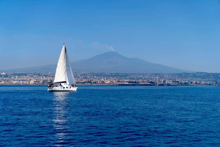 Catania: Cyclops Coast Cruise with Appetizer & Snorkeling - The first run along Catania’s black lava shore