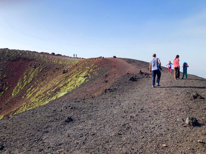 Catania: Etna Morning Excursion with Tasting and Pickup - Entering an old lava cave with a helmet and flashlight
