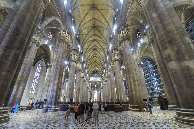 Milan Super Saver: Skip-the-Line Duomo and Rooftop Guided Tour - Inside the Duomo: marble, glass, and immense scale