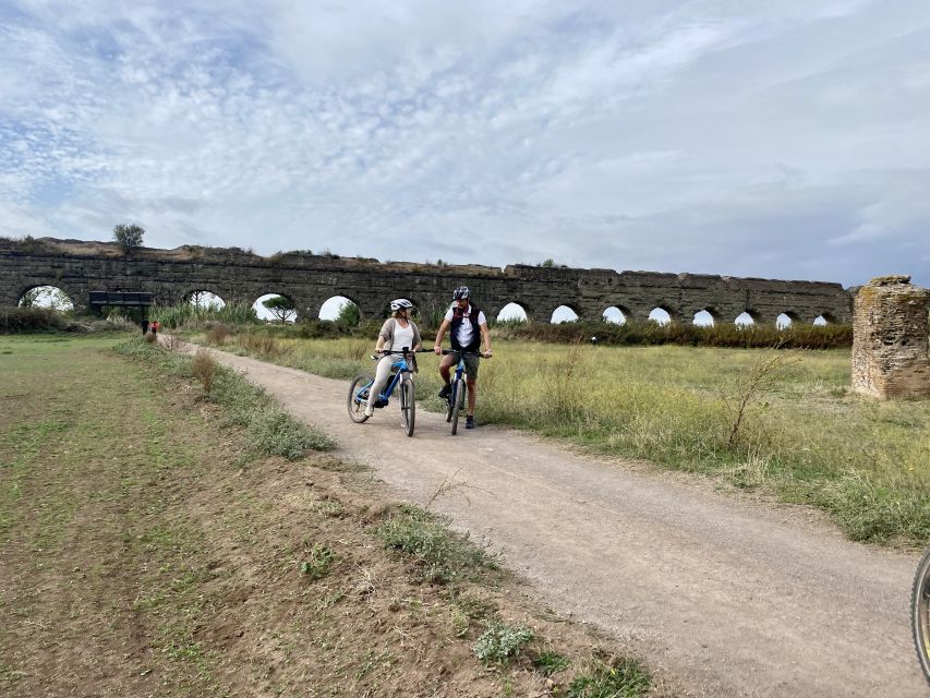 Rome:Appian Way E-bike Tour with Catacombs, Aqueducts & Food - Ancient ruins along the Appian Way