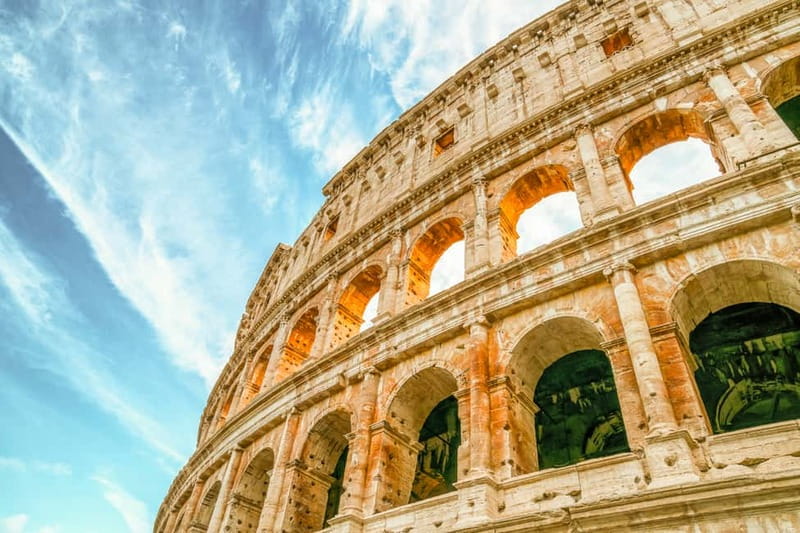 Rome: Colosseum & Forum Small Group Tour with Palatine Hill - Entering the Colosseum through the first and second tiers
