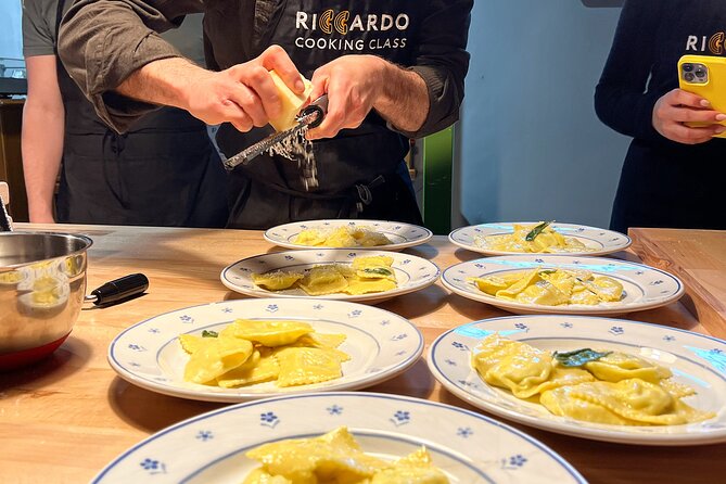 Rome Pasta Making Class with Italian Sauces and Wine Included - Rolling dough, shaping ravioli, and making three pastas