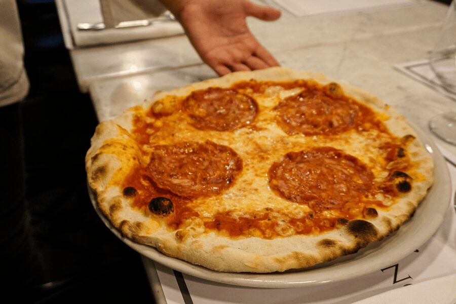 Rome: Traditional Pizza Cooking Class near Piazza Navona - Stretching, tossing, and choosing toppings