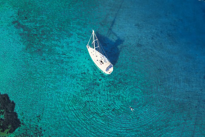 Sailing Cruise to Dia Island with Meal and Water Activities - Swimming, snorkeling, fishing, and paddleboarding