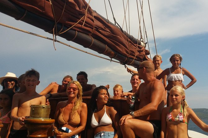 Sailing day trip on Tall Ship Andrea Jensen with Lunch and Wine - Seeing Capo Caccia’s vertical cliffs from offshore