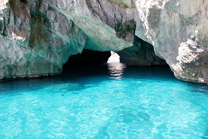 Small Group Capri Island Boat Ride with Swimming and Limoncello - The Faraglioni stop: Capri’s signature moment