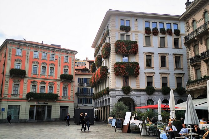 Small-Group Lake Como & Lugano by Swiss Train + Boat Cruise - Lake Como by boat, with villa views from the water