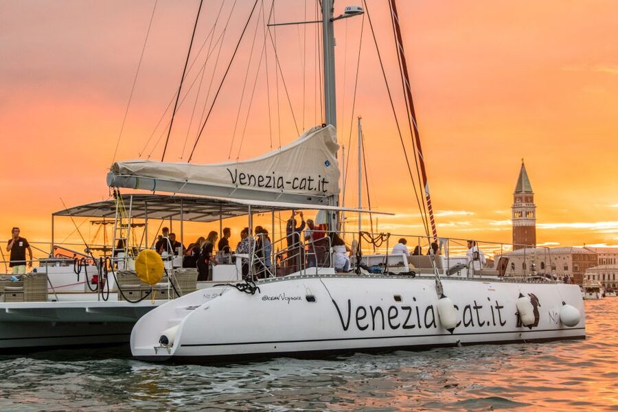 Venice: Catamaran Sunset Jazz Cruise with Aperitivo - Boarding a roomy catamaran with several ways to sit